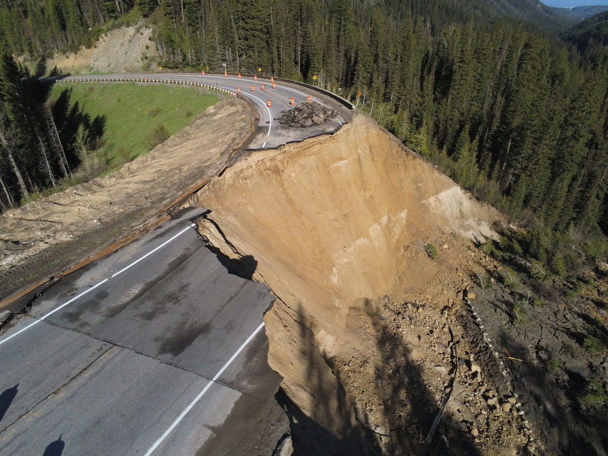 Cracks in the roadway on Teton Pass are seen on Friday