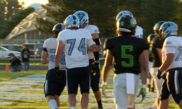Skyline and Blackfoot players return to their huddles after a touchdown.