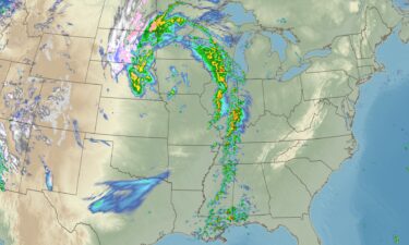 A forecast model shows where a powerful storm could produce rain and thunderstorms (greens through reds) and snow (whites through purples) late Friday night.