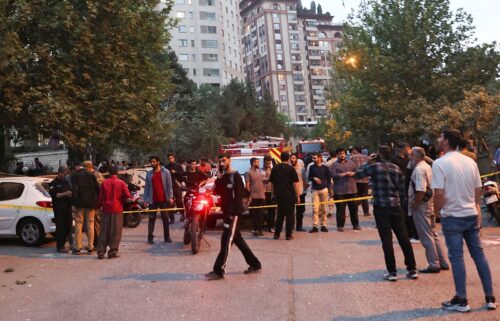 People gather in the street in the aftermath of Israeli strikes